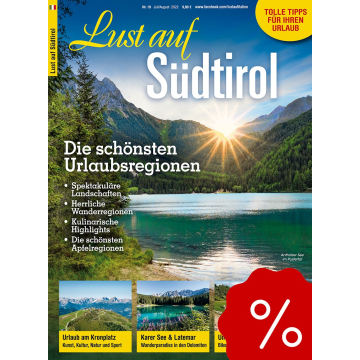 Titelblatt einer Zeitschrift mit dem Titel 'Lust auf Südtirol', zeigt einen See mit Bergen im Hintergrund und Sonnenstrahlen, dazu kleine Fotos von Berglandschaften und Wanderregionen.
