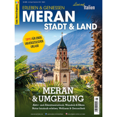 Titelblatt einer Zeitschrift mit dem Turm einer Kirche vor Berglandschaft und Palmen im Vordergrund